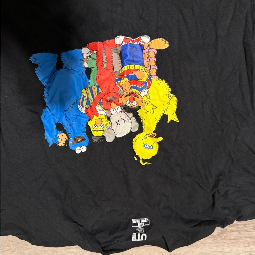 KAWS Black Tee with White Logo and Multicolor Graphic